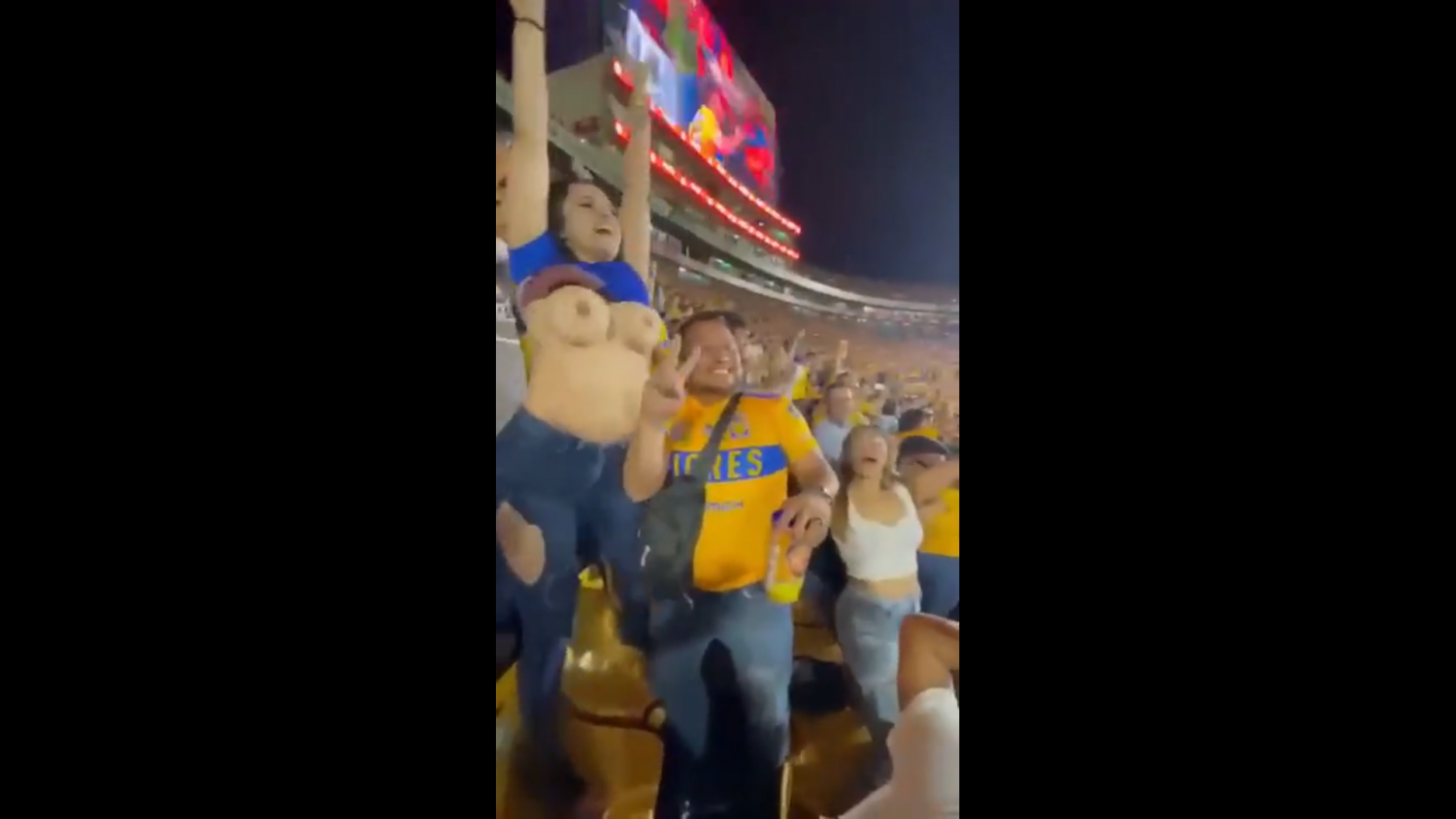 Mexican female fan Carla Garza lifting up her shirt showing her...